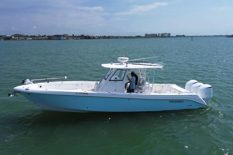  Yacht Photos Pics 2015 Everglades 355 Center Console boat on calm water, side view.
