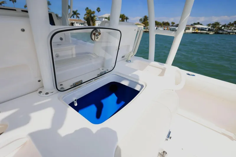  Yacht Photos Pics Everglades 355 Center Console 2015 with open storage compartment by the water.