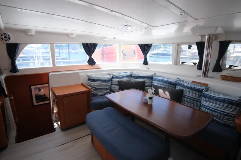Sv Hypnautic Yacht Photos Pics Interior of 2002 Lagoon 440 catamaran with cozy seating and large windows.