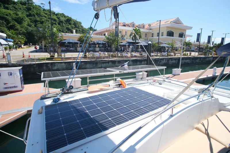 Sv Hypnautic Yacht Photos Pics Lagoon 440 catamaran with solar panels docked near waterfront cafes, 2002 model.
