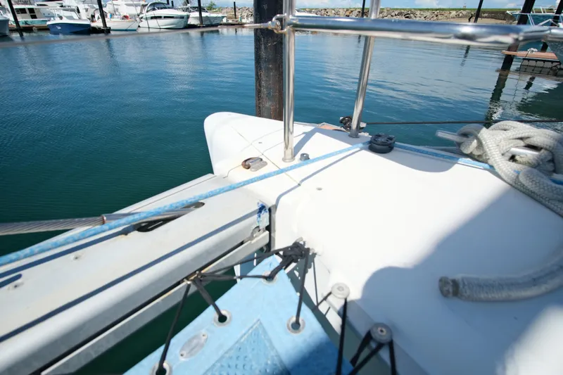 Sv Hypnautic Yacht Photos Pics Bow of a 2002 Lagoon 440 catamaran docked at a marina.