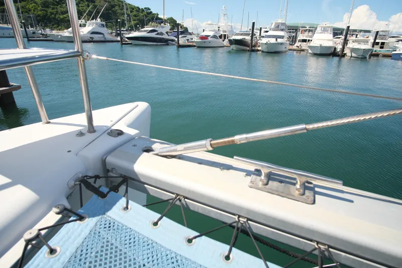 Sv Hypnautic Yacht Photos Pics Lagoon 440 catamaran deck view in marina, showcasing mooring cleat and netting, 2002 model.