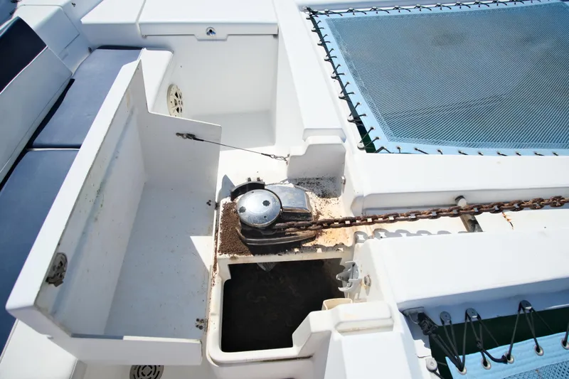 Sv Hypnautic Yacht Photos Pics Deck of 2002 Lagoon 440 catamaran featuring anchor chain and storage compartments.