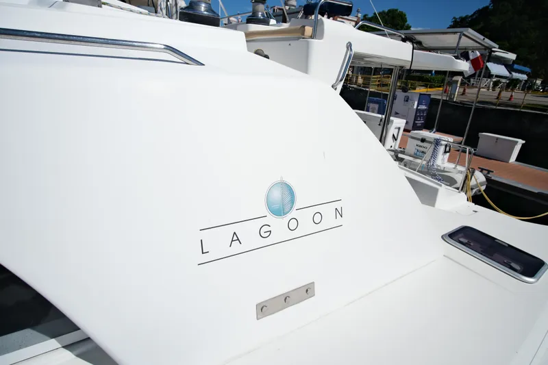 Sv Hypnautic Yacht Photos Pics Lagoon 440 catamaran, 2002 model, docked at marina with logo visible.