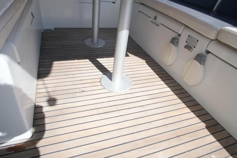 Sv Hypnautic Yacht Photos Pics Wooden deck of a 2002 Lagoon 440 catamaran, featuring clean lines and sturdy construction.