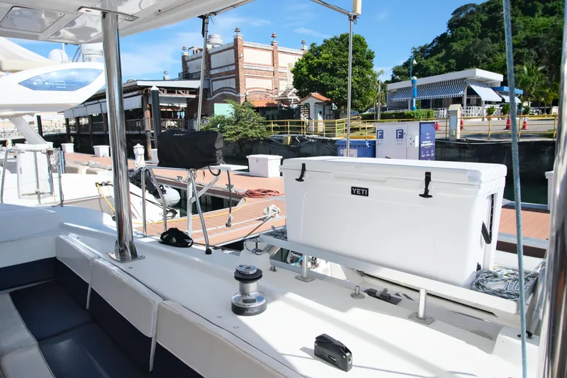 Sv Hypnautic Yacht Photos Pics Lagoon 440 catamaran docked, featuring a Yeti cooler on deck, 2002 model.