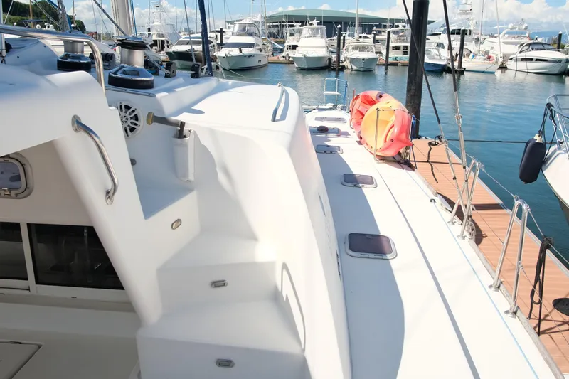 Sv Hypnautic Yacht Photos Pics Lagoon 440 catamaran docked at marina, showcasing deck and nearby boats, 2002 model.