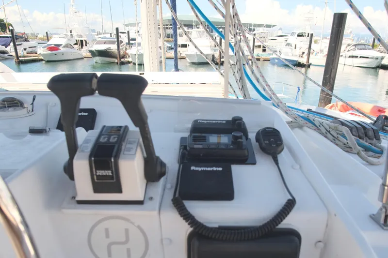 Sv Hypnautic Yacht Photos Pics Control panel of a 2002 Lagoon 440 catamaran docked at a marina.