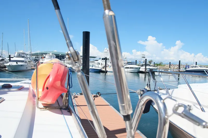 Sv Hypnautic Yacht Photos Pics Lagoon 440 catamaran docked at marina, clear sky, 2002 model.