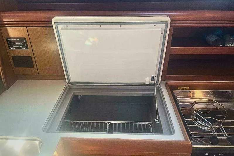 Phantom Yacht Photos Pics 2007 Jeanneau Sun Odyssey 39i yacht kitchen with open fridge and stove.