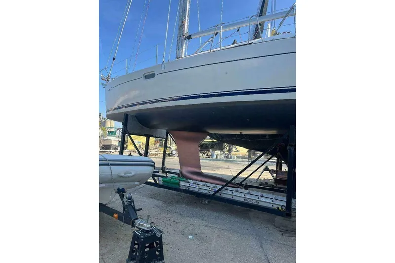 Phantom Yacht Photos Pics 2007 Jeanneau Sun Odyssey 39i sailboat on dry dock, showing hull and keel.