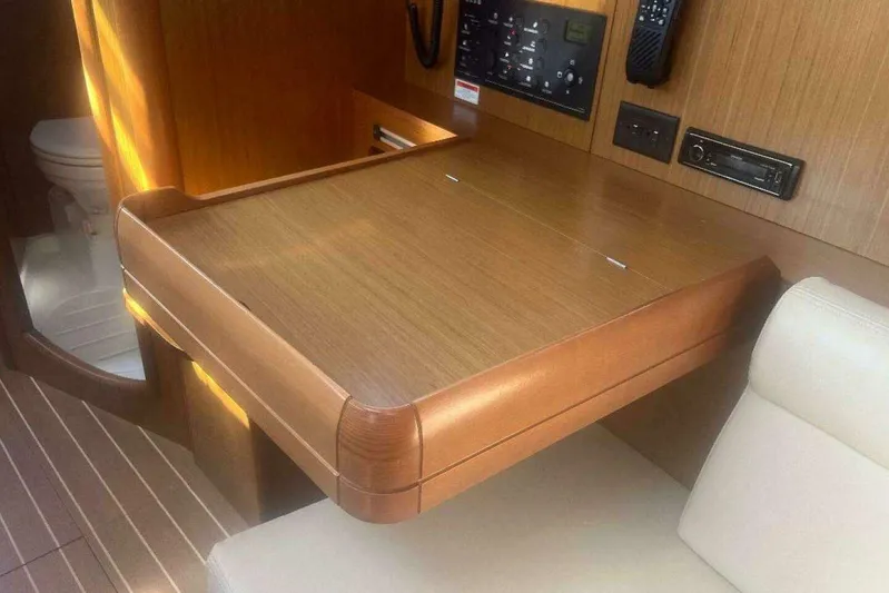 Phantom Yacht Photos Pics Interior of 2007 Jeanneau Sun Odyssey 39i yacht with navigation station and seating.