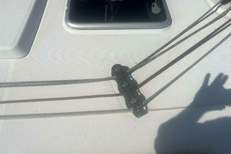 Phantom Yacht Photos Pics Deck of 2007 Jeanneau Sun Odyssey 39i sailboat with rigging lines and shadow.