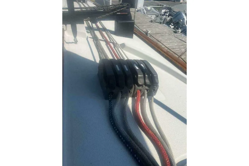 Phantom Yacht Photos Pics Deck rigging on a 2007 Jeanneau Sun Odyssey 39i sailboat, featuring multiple ropes and clutches.