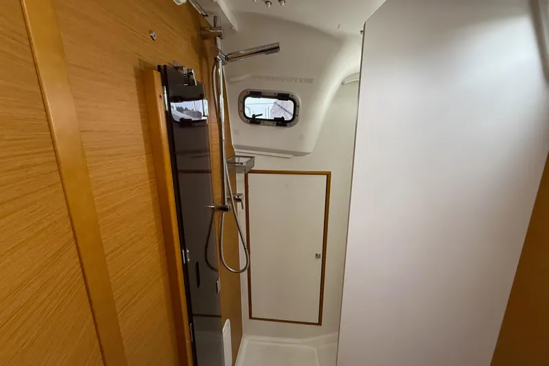 A Bientot Yacht Photos Pics Interior of 2016 Jeanneau Sun Odyssey 349 yacht bathroom with shower.