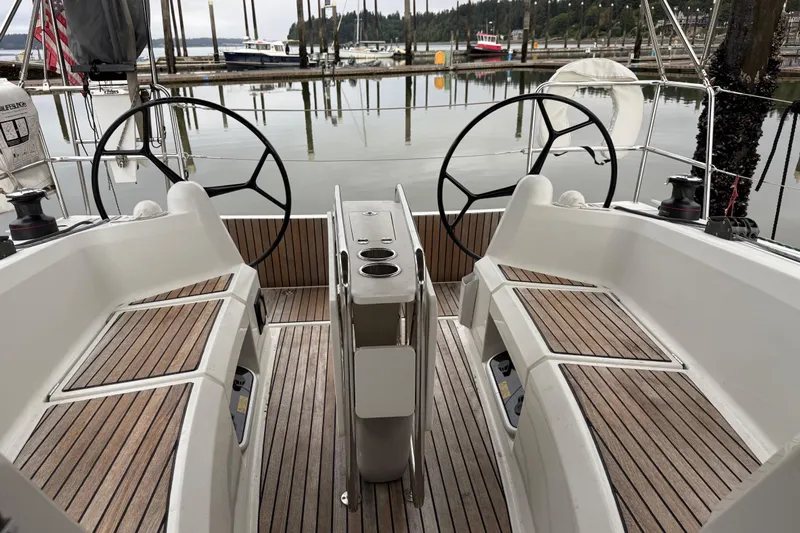 A Bientot Yacht Photos Pics Cockpit of 2016 Jeanneau Sun Odyssey 349 sailboat with dual steering wheels.
