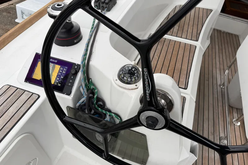 A Bientot Yacht Photos Pics Steering wheel and navigation equipment on 2016 Jeanneau Sun Odyssey 349 sailboat.