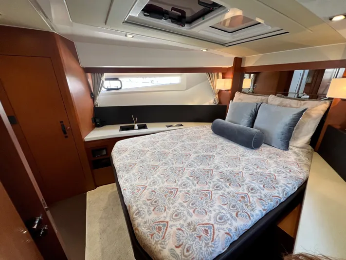  Yacht Photos Pics Luxurious cabin interior of 2017 Jeanneau Velasco 43 yacht with elegant bedding and wood finishes.