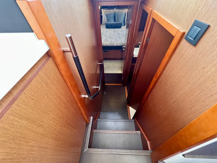  Yacht Photos Pics Staircase leading to cabin interior of 2017 Jeanneau Velasco 43 yacht.