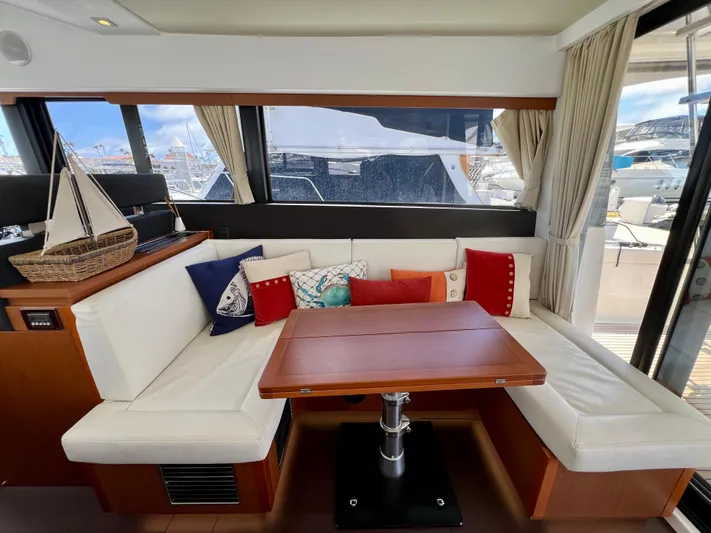  Yacht Photos Pics Luxurious interior of 2017 Jeanneau Velasco 43 yacht with cozy seating and decorative pillows.
