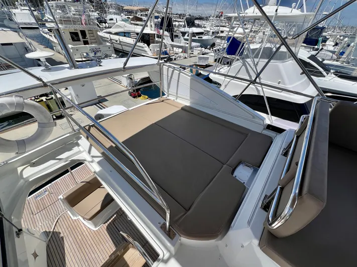  Yacht Photos Pics Flybridge view of 2017 Jeanneau Velasco 43 yacht in a marina setting.