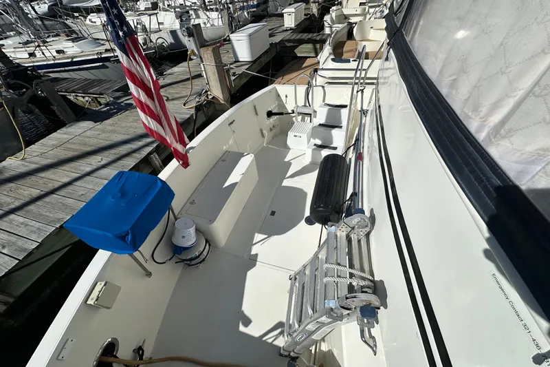  Yacht Photos Pics Novatec Islander 55 yacht deck, 2006 model, docked with American flag displayed.