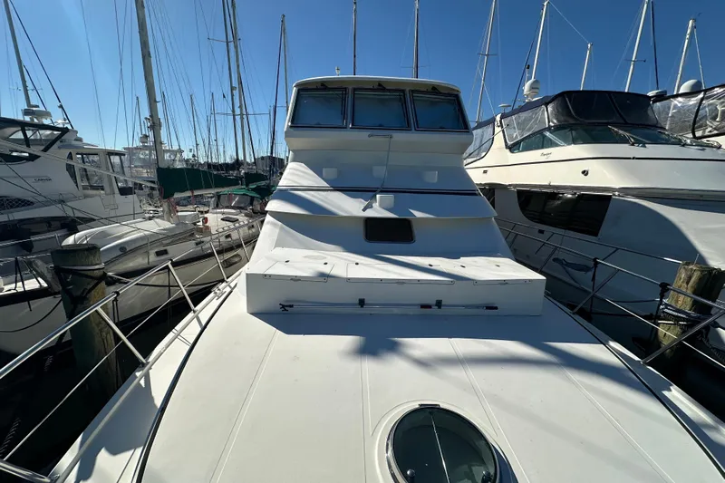  Yacht Photos Pics 2006 Novatec Islander 55 yacht docked among other boats in a marina.