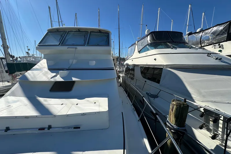  Yacht Photos Pics 2006 Novatec Islander 55 yacht docked at marina under clear blue sky.