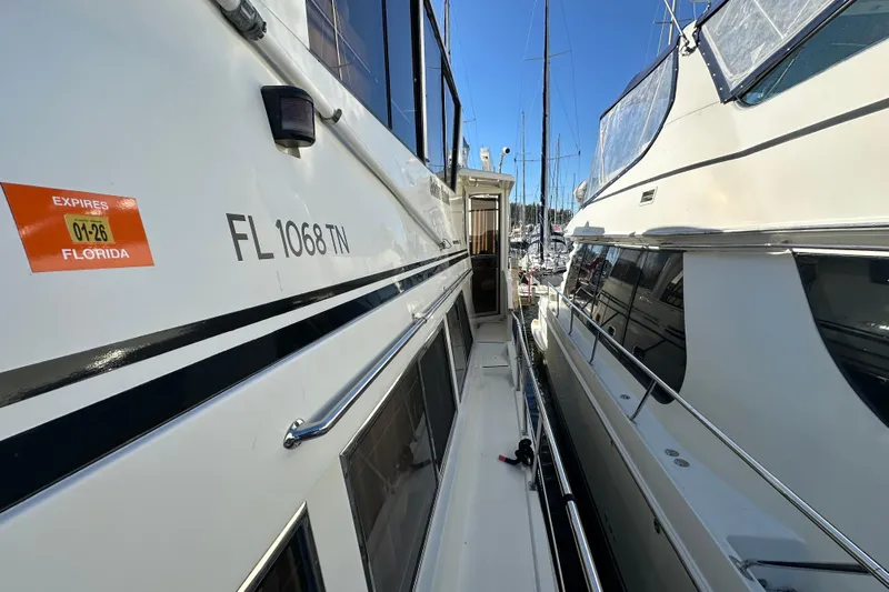  Yacht Photos Pics 2006 Novatec Islander 55 yacht docked, side view with Florida registration.