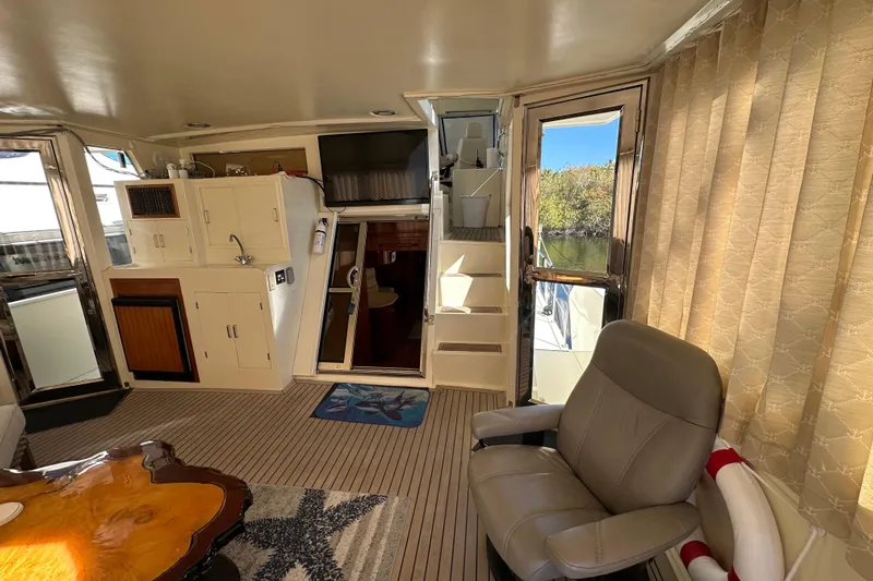  Yacht Photos Pics Interior of 2006 Novatec Islander 55 yacht with seating, kitchenette, and stairs.