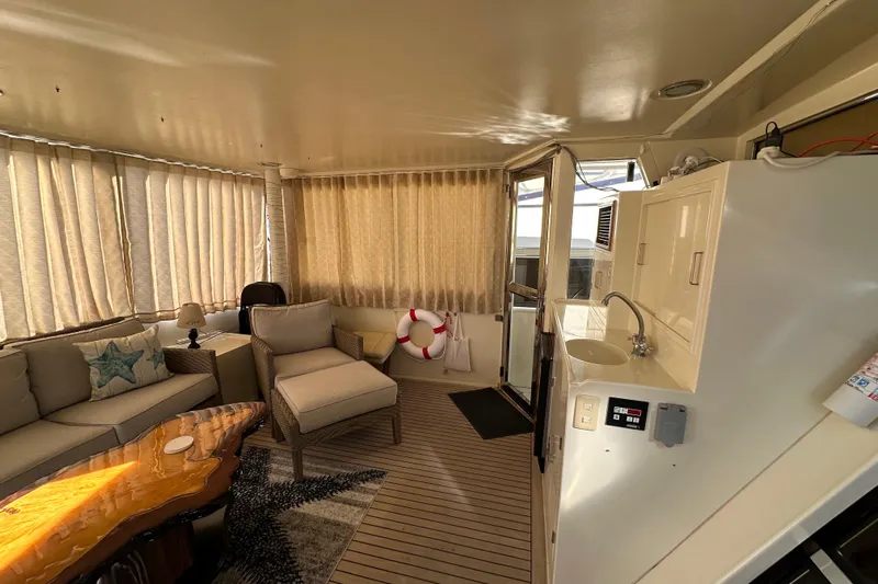  Yacht Photos Pics Luxurious interior of 2006 Novatec Islander 55 yacht with cozy seating and elegant decor.