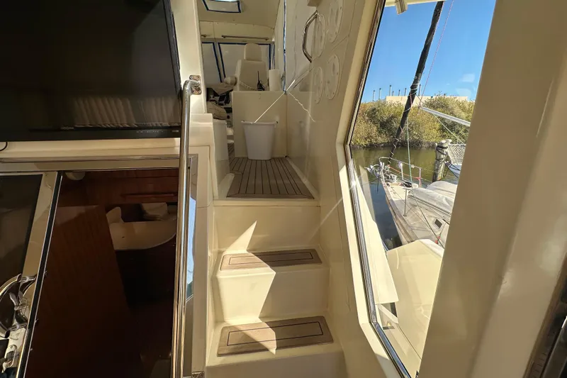  Yacht Photos Pics Stairway inside 2006 Novatec Islander 55 yacht, leading to upper deck with outdoor view.