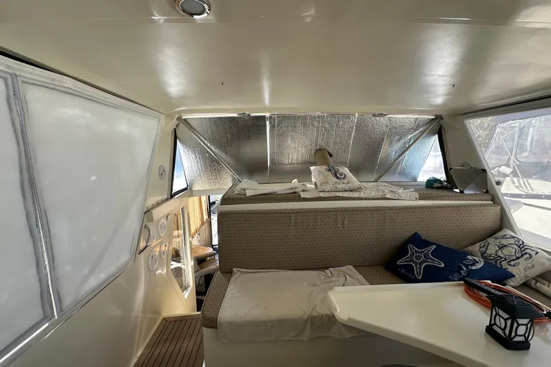  Yacht Photos Pics Interior of 2006 Novatec Islander 55 yacht with cozy seating and nautical decor.