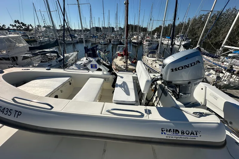  Yacht Photos Pics Novatec Islander 55 (2006) yacht with Honda outboard motor in marina setting.