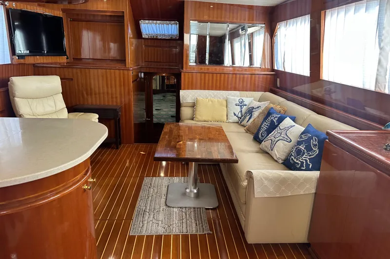  Yacht Photos Pics Luxurious interior of 2006 Novatec Islander 55 yacht with elegant wood finishes and cozy seating.