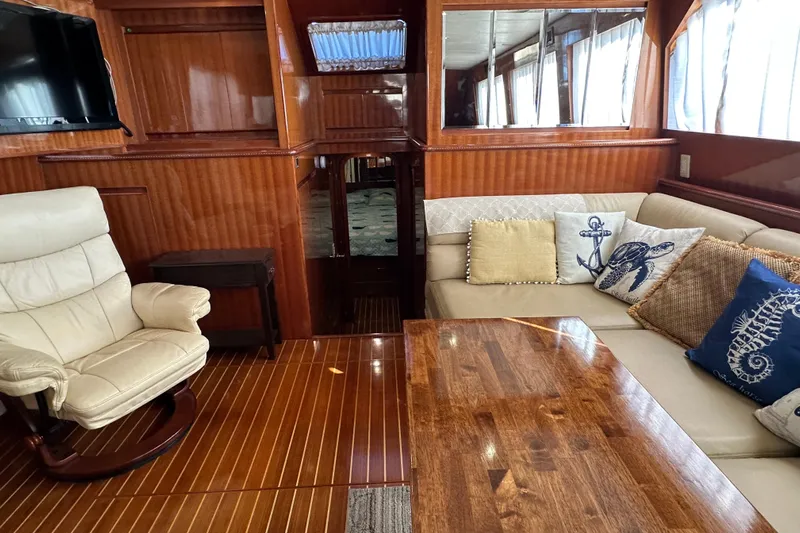  Yacht Photos Pics Luxurious 2006 Novatec Islander 55 yacht interior with elegant wood finish and cozy seating.