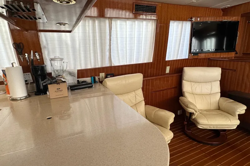  Yacht Photos Pics Luxurious interior of 2006 Novatec Islander 55 yacht with leather chairs and modern amenities.