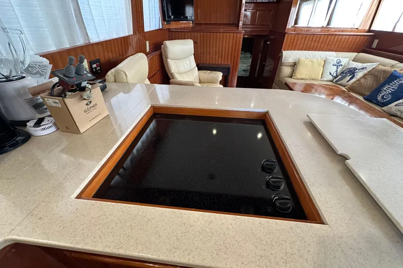  Yacht Photos Pics Luxurious 2006 Novatec Islander 55 yacht interior with modern kitchen and comfortable seating.