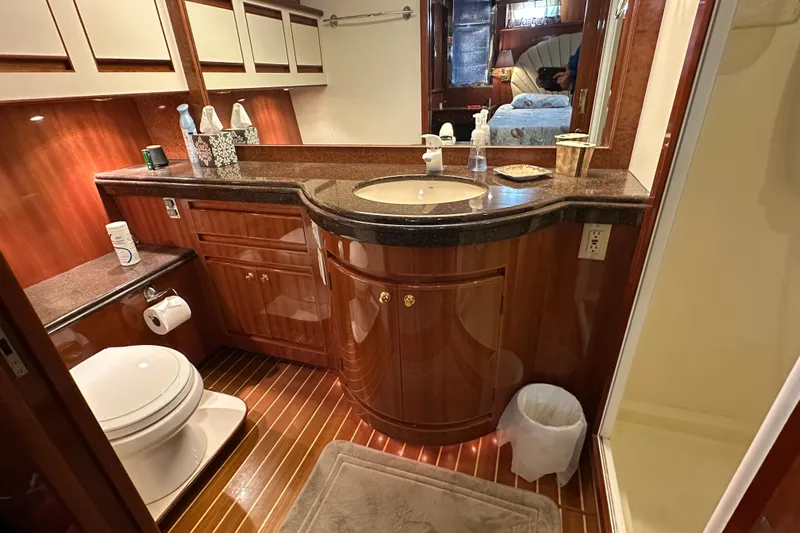  Yacht Photos Pics Luxurious bathroom in 2006 Novatec Islander 55 yacht with elegant wood finishes.