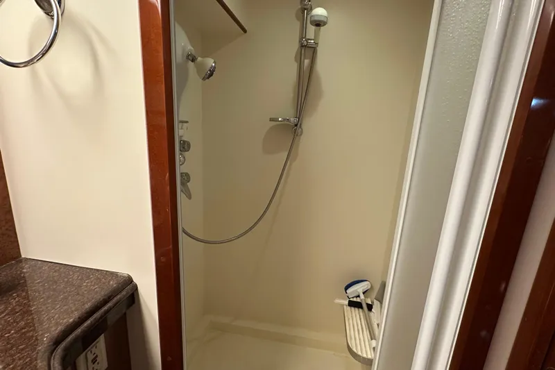  Yacht Photos Pics Shower area in 2006 Novatec Islander 55 yacht, featuring modern fixtures and a bench.