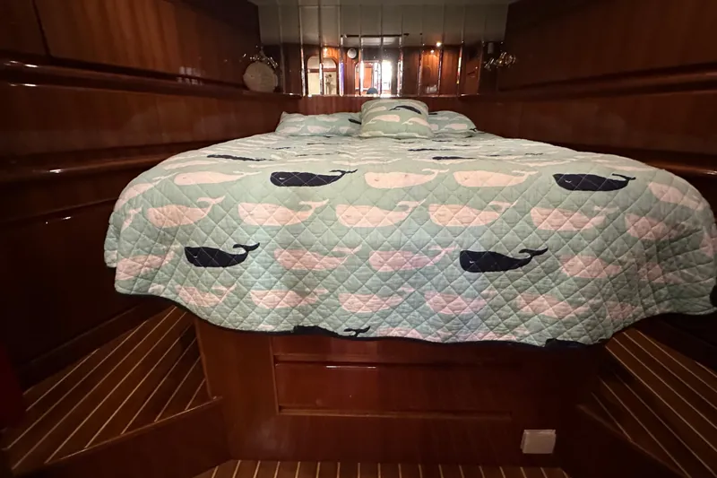  Yacht Photos Pics Luxurious cabin interior of 2006 Novatec Islander 55 yacht with whale-patterned bedding.