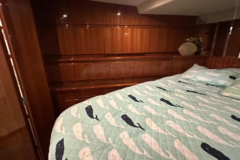 Yacht Photos Pics Luxurious bedroom interior of 2006 Novatec Islander 55 yacht with whale-patterned bedding.