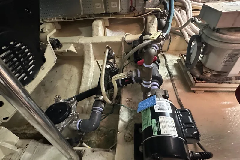  Yacht Photos Pics Engine room of 2006 Novatec Islander 55 yacht, showcasing mechanical components and piping.