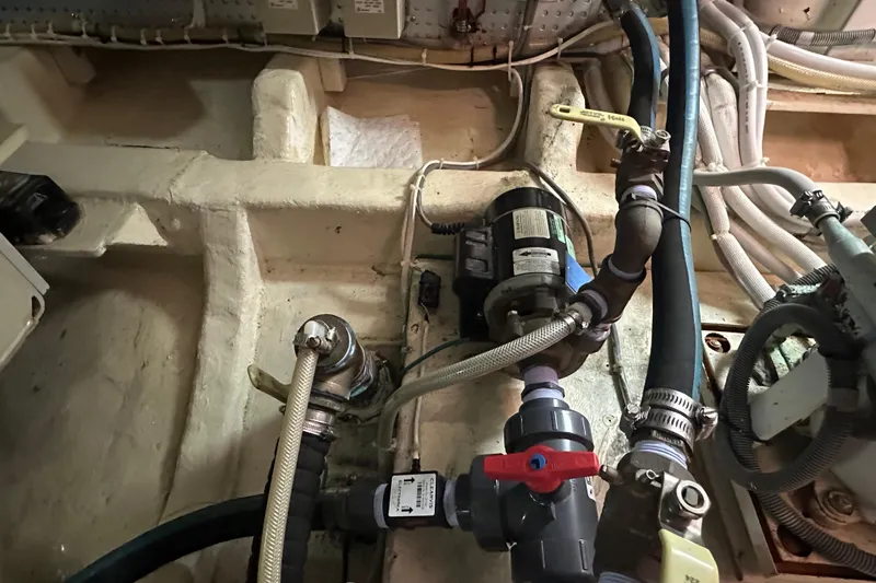  Yacht Photos Pics Engine room of 2006 Novatec Islander 55 with visible plumbing and wiring.