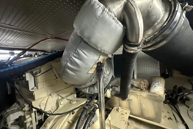  Yacht Photos Pics Engine room of 2006 Novatec Islander 55 yacht, showcasing insulated components and piping.