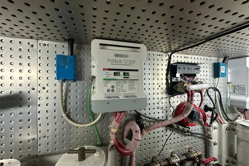  Yacht Photos Pics Electrical panel on a 2006 Novatec Islander 55 yacht, featuring ProNautic 1230P charger.