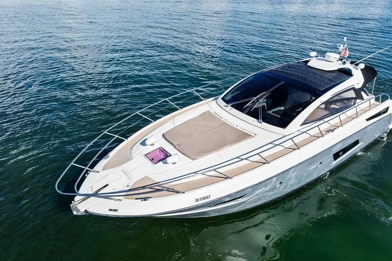  Yacht Photos Pics 2013 Azimut Atlantis 48 yacht cruising on calm waters, showcasing sleek design and luxury features.