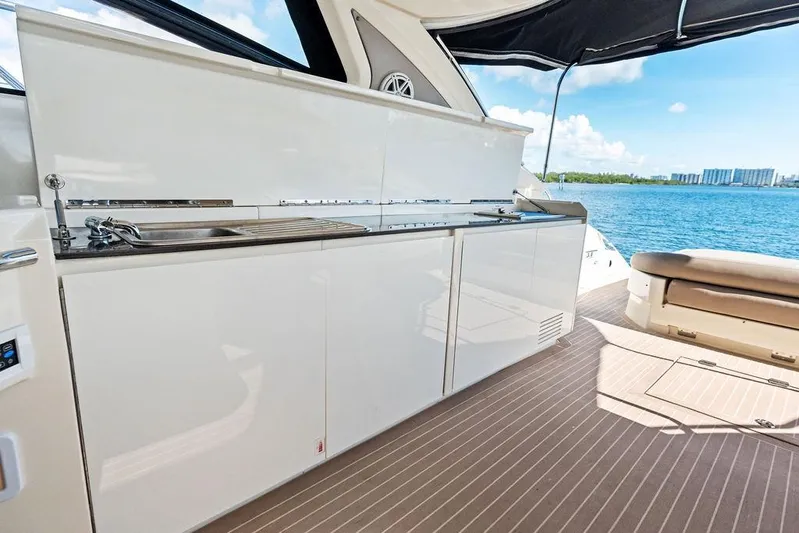  Yacht Photos Pics Luxurious 2013 Azimut Atlantis 48 yacht interior with kitchenette and ocean view.
