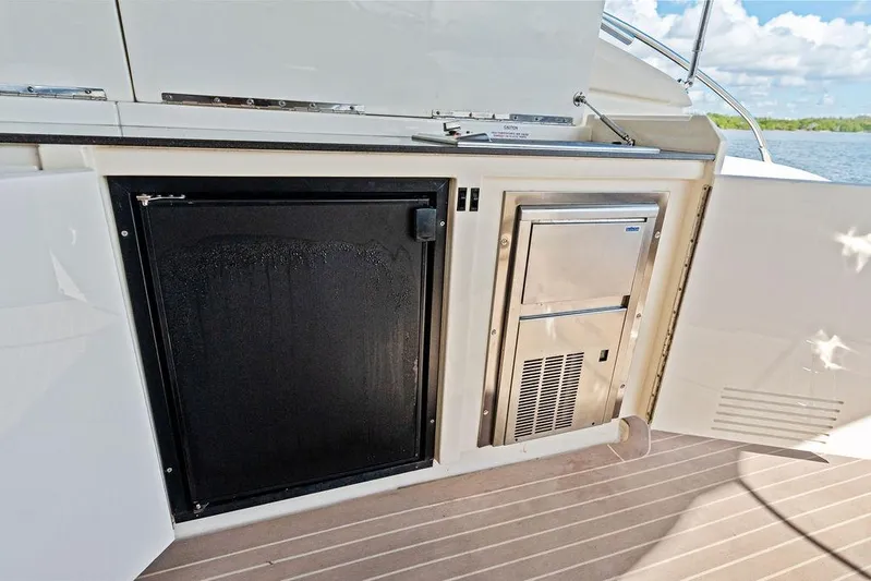  Yacht Photos Pics Azimut Atlantis 48 yacht kitchenette with fridge and storage, 2013 model, on deck view.