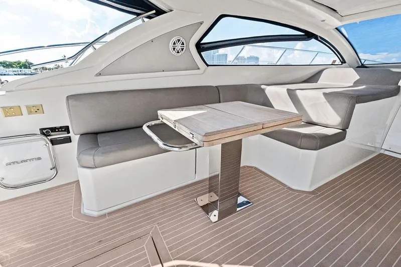  Yacht Photos Pics Interior of 2013 Azimut Atlantis 48 yacht with sleek seating and modern table design.